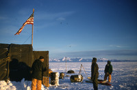 Camp builders, 5 of us, look at the flag.  Commonwealth Range in background thumbnail