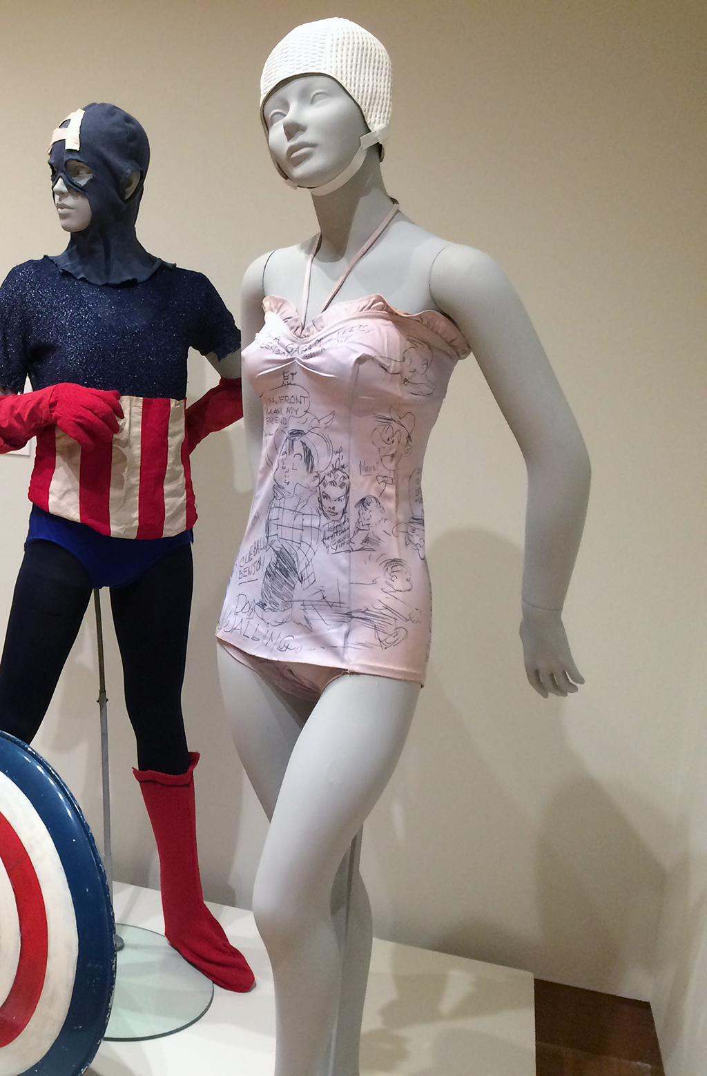 Photograph of bathing suit covered in cartoon artwork