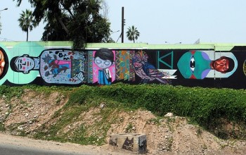 brightly painted mural wall that divides the earth